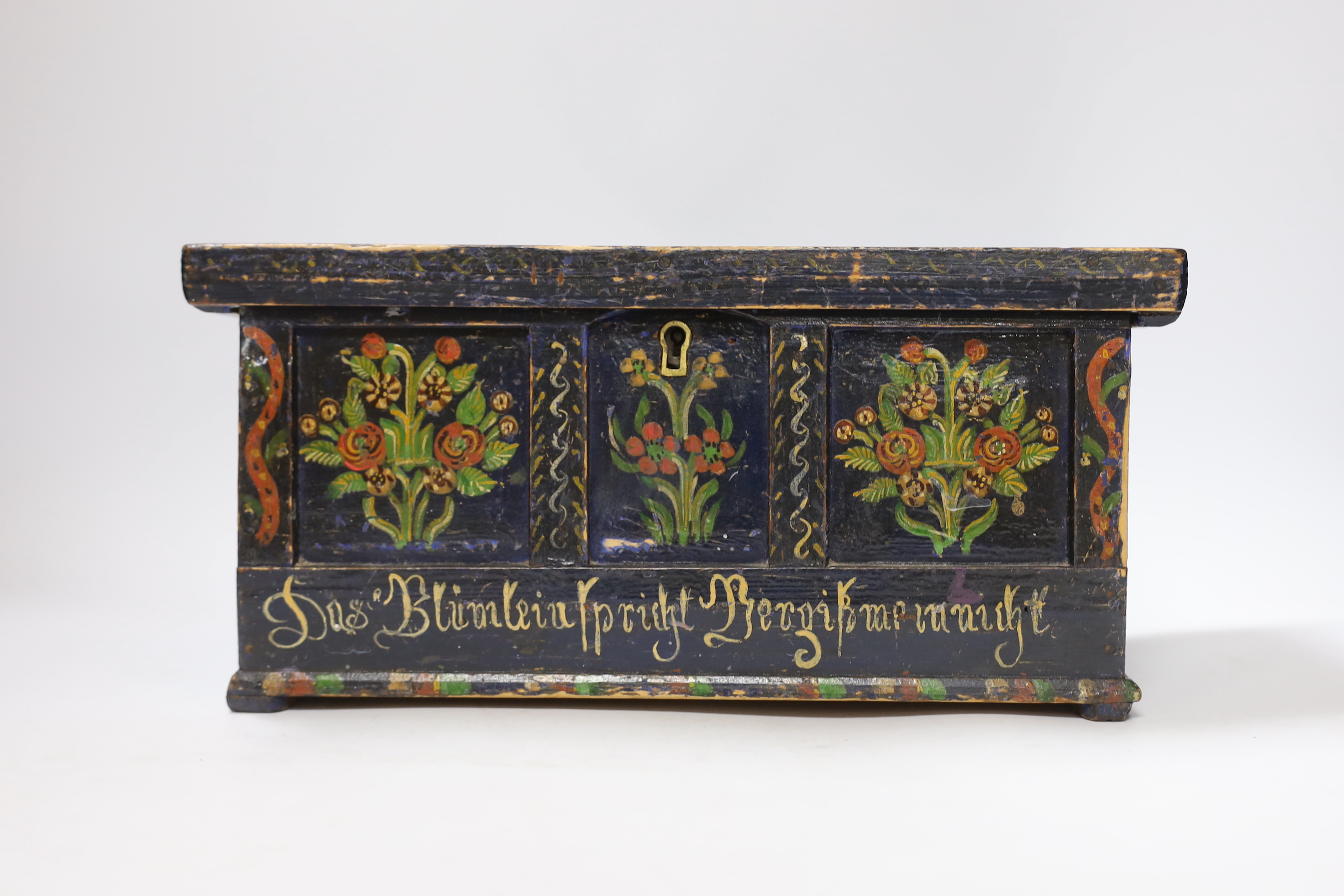 A 19th century German or Austrian floral painted pine casket, 32cm wide